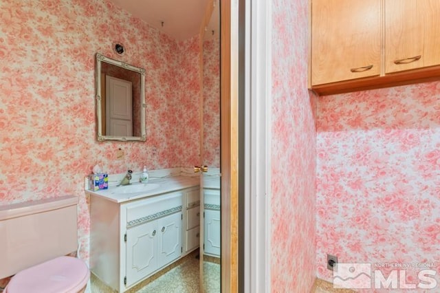 bathroom with vanity and toilet