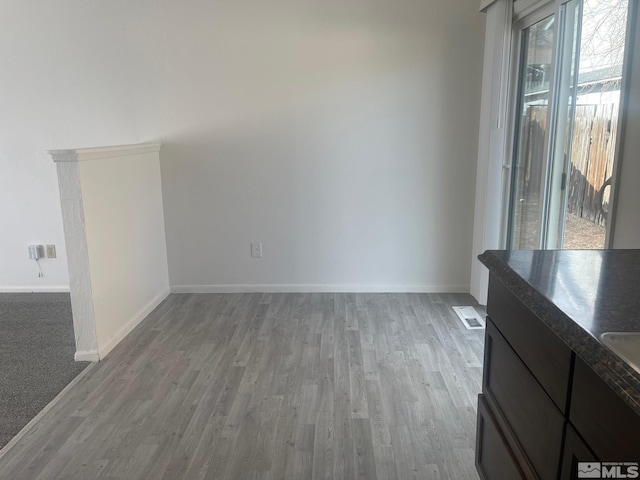 unfurnished living room featuring wood-type flooring