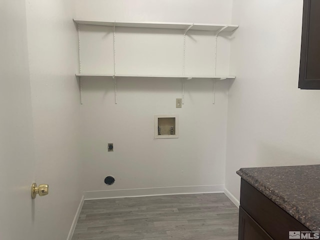 washroom with electric dryer hookup, washer hookup, and dark hardwood / wood-style floors