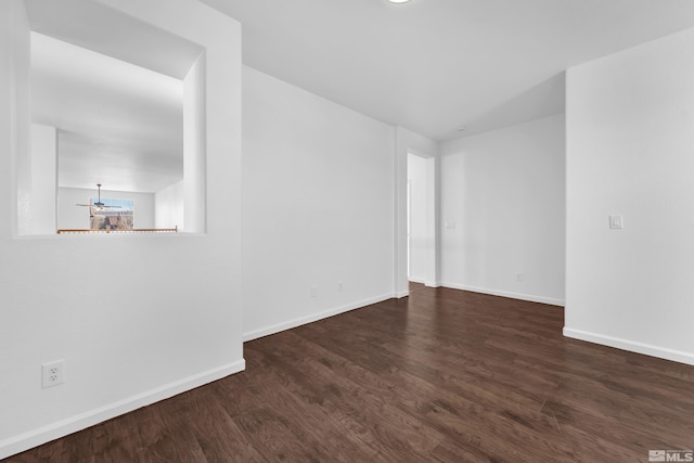 empty room featuring dark hardwood / wood-style flooring