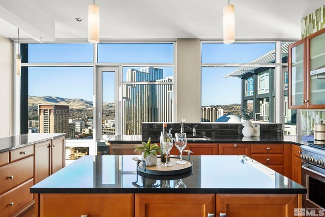 kitchen featuring a mountain view, decorative light fixtures, and a kitchen island