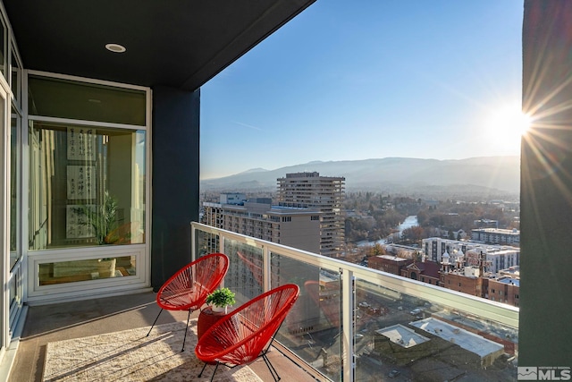 balcony featuring a mountain view