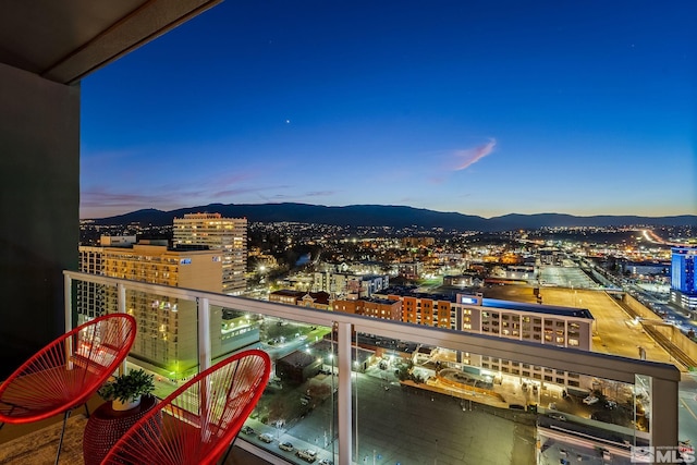 balcony at dusk with a mountain view