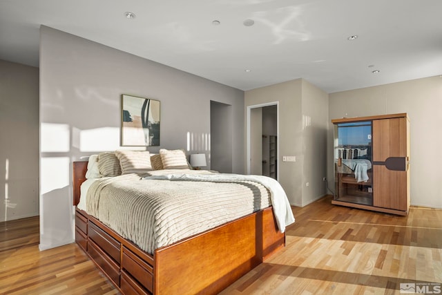 bedroom with light hardwood / wood-style floors