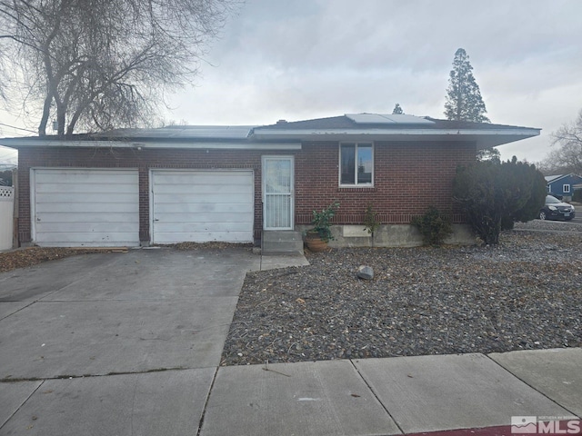 ranch-style home featuring a garage