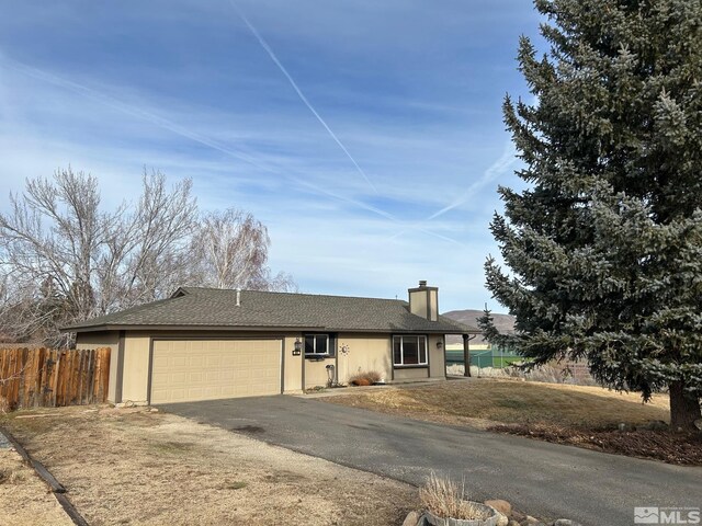 single story home with a garage