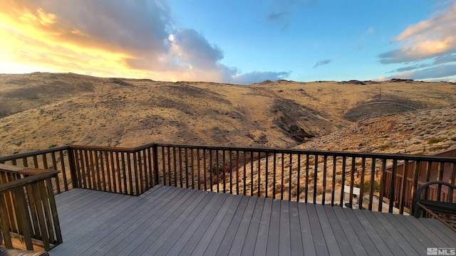 deck at dusk with a mountain view