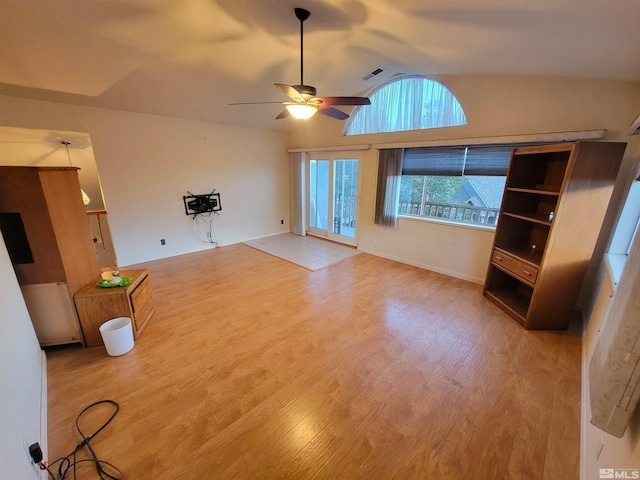 unfurnished living room with hardwood / wood-style floors, ceiling fan, and lofted ceiling