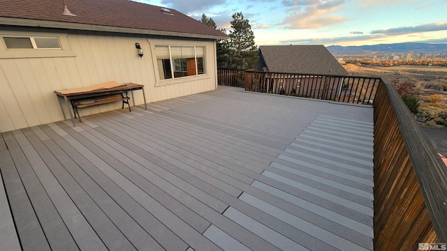 deck at dusk with a mountain view