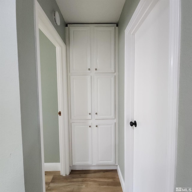 hallway featuring light hardwood / wood-style flooring