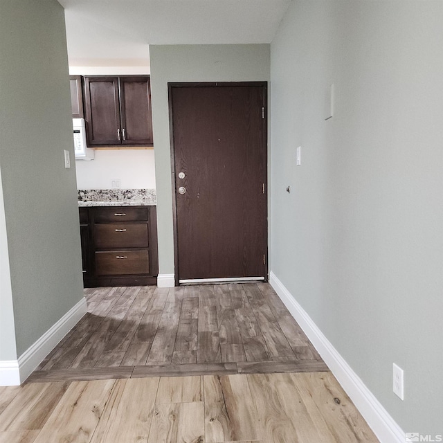 corridor featuring light hardwood / wood-style flooring