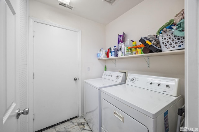 washroom with washing machine and dryer