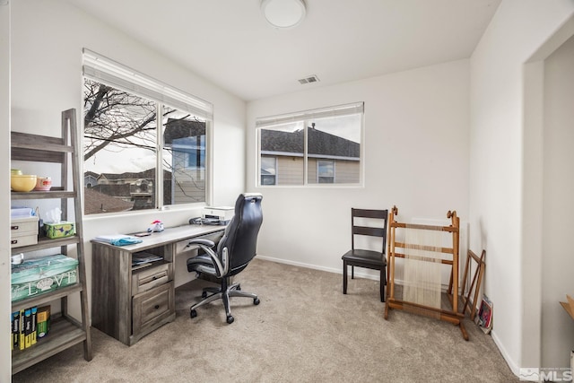 office space with light colored carpet