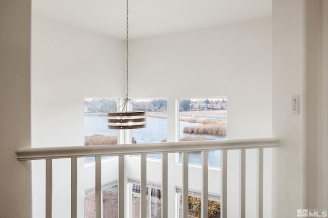 room details with a chandelier and a water view