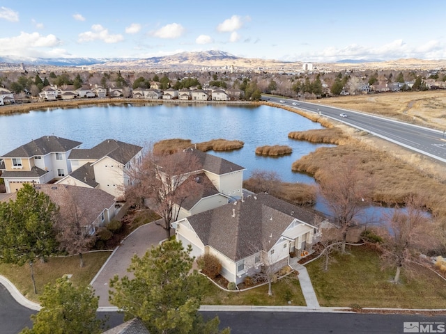 aerial view featuring a water and mountain view