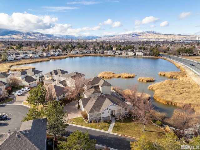 birds eye view of property featuring a water and mountain view