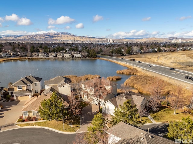 bird's eye view featuring a water and mountain view