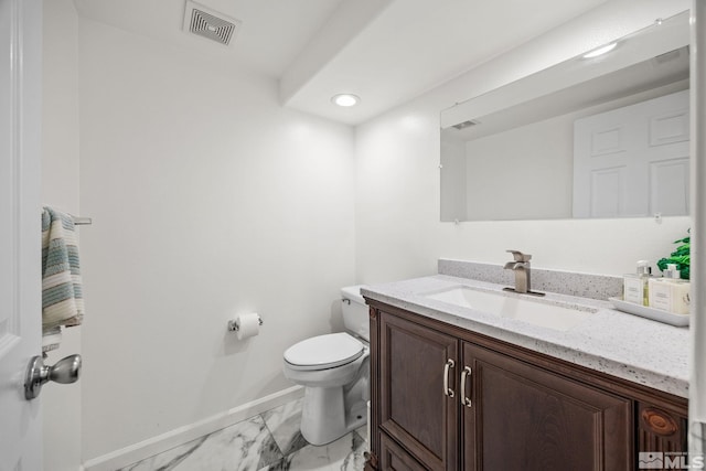 bathroom with vanity and toilet