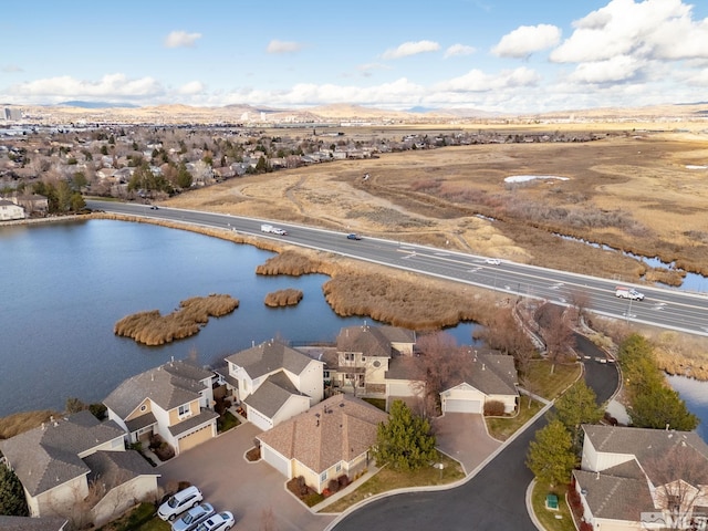 bird's eye view featuring a water and mountain view