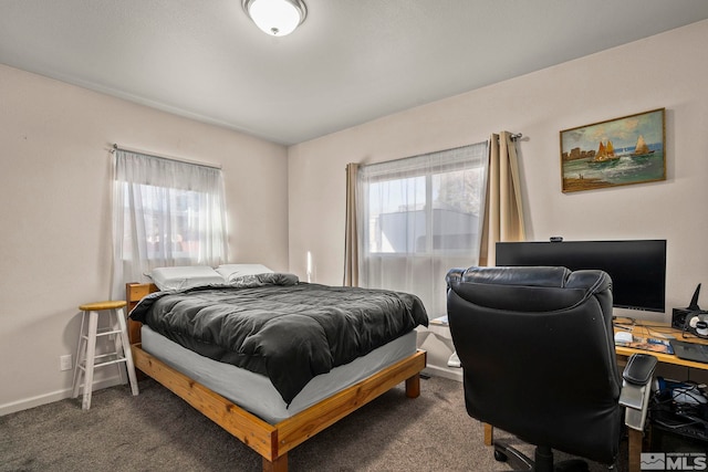 bedroom featuring dark colored carpet