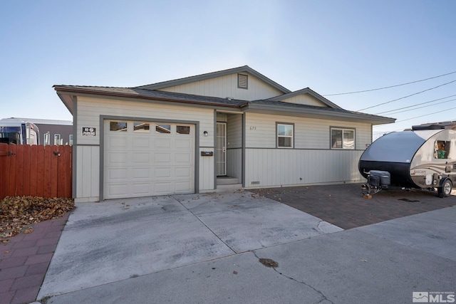 single story home featuring a garage