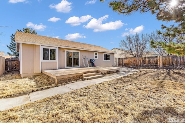 back of property with a patio