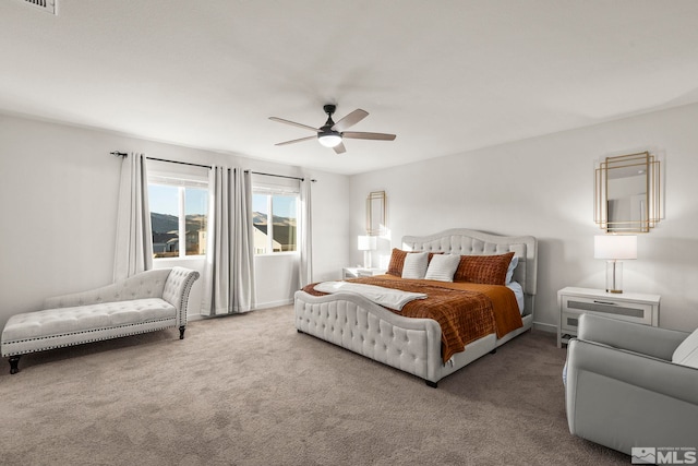 bedroom with ceiling fan and carpet floors