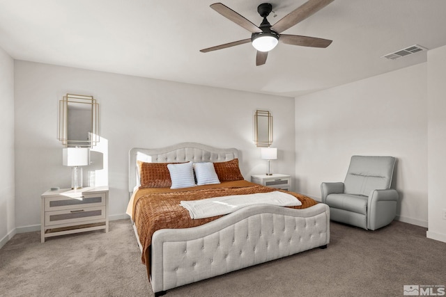 bedroom with ceiling fan and light colored carpet