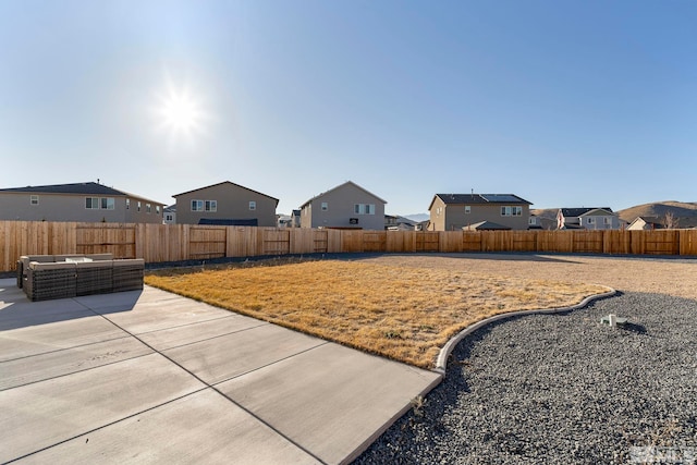 view of yard with an outdoor living space and a patio area