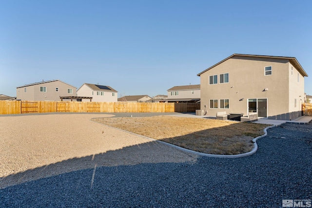 back of property featuring a patio