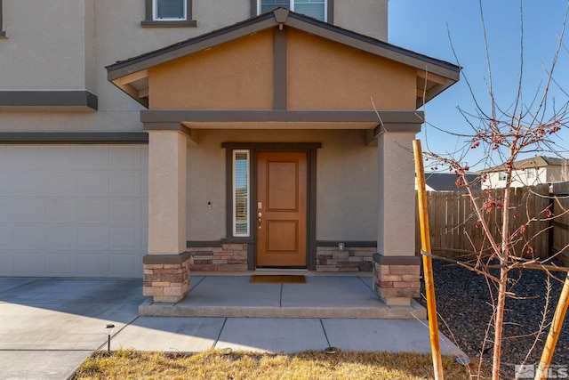 entrance to property featuring a garage