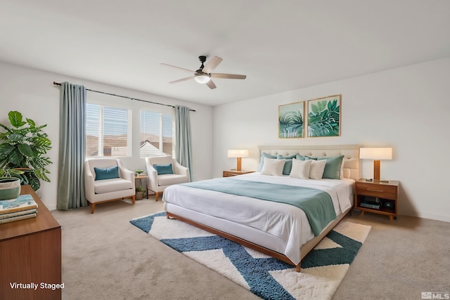 bedroom featuring ceiling fan and light colored carpet