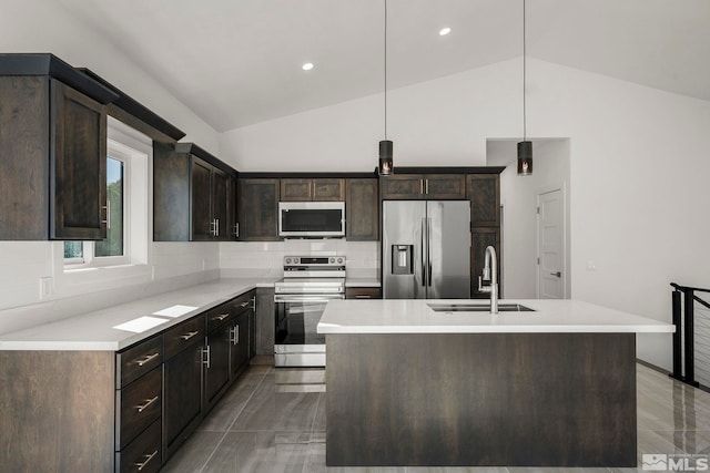 kitchen featuring backsplash, dark brown cabinetry, light countertops, stainless steel appliances, and a sink