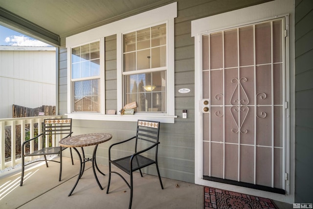 property entrance with covered porch