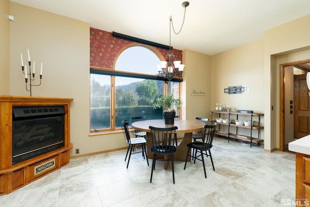 dining space with a notable chandelier