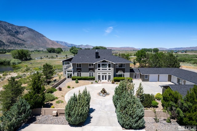 exterior space with a mountain view and a balcony