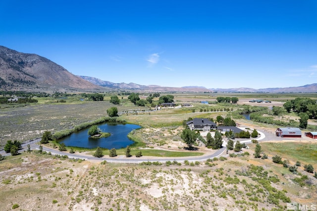 birds eye view of property with a rural view and a water and mountain view