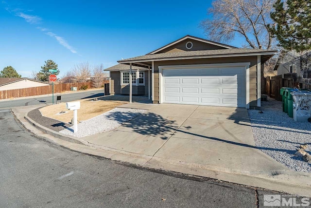 ranch-style house featuring a garage