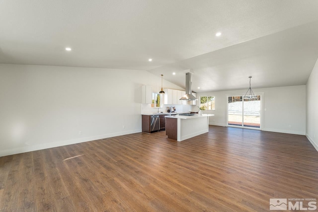 unfurnished living room with lofted ceiling and dark wood-type flooring