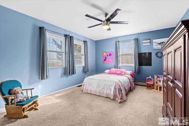 bedroom featuring carpet flooring, ceiling fan, and baseboard heating