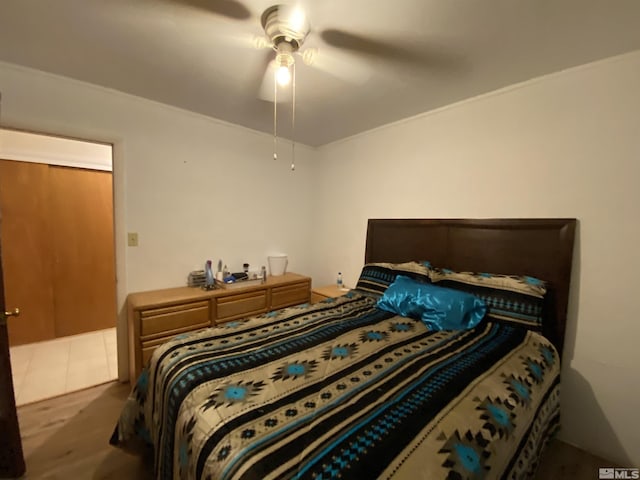 bedroom with ceiling fan and dark hardwood / wood-style floors