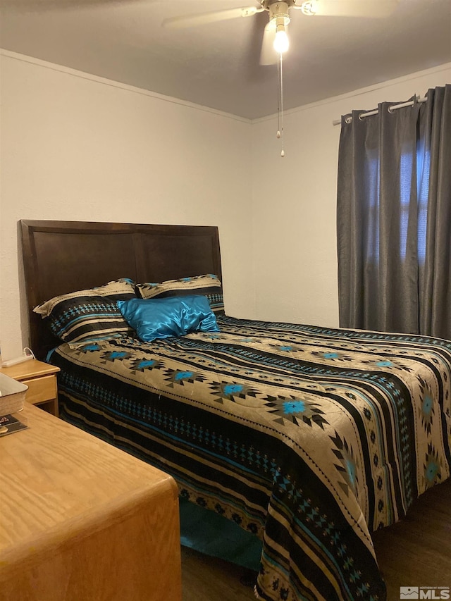 bedroom with ceiling fan, hardwood / wood-style floors, and ornamental molding