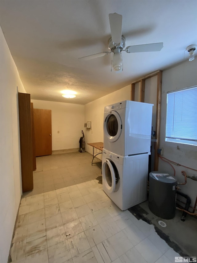 laundry area with ceiling fan and stacked washer and dryer