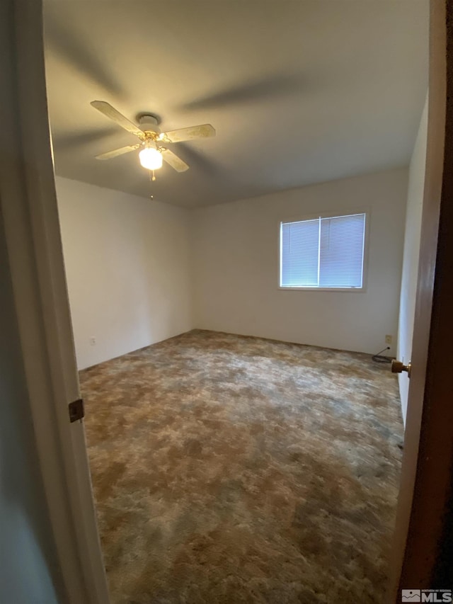 carpeted empty room with ceiling fan