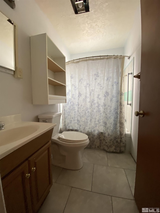 full bathroom featuring tile patterned flooring, vanity, shower / tub combo, and toilet