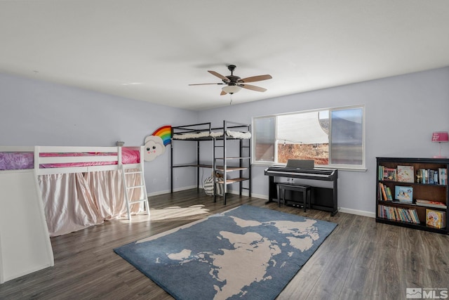 bedroom featuring ceiling fan and dark hardwood / wood-style flooring