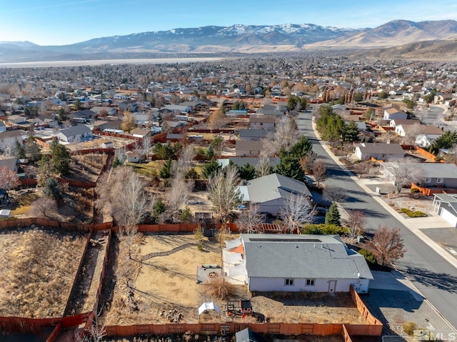 birds eye view of property with a mountain view