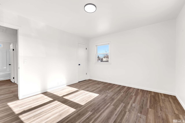 empty room featuring hardwood / wood-style floors