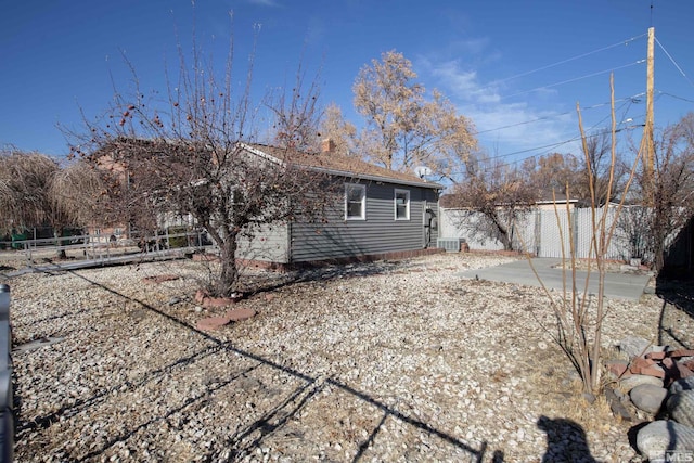 rear view of property featuring a patio area