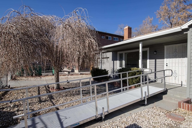 view of side of property with covered porch